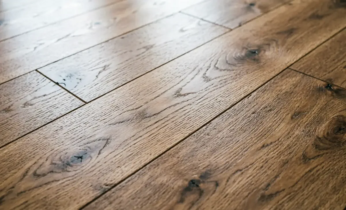 Close-up of NuCore-style wood-look luxury vinyl plank flooring showing texture and seams
